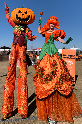 Pumkin prince and Princess stilt walkers